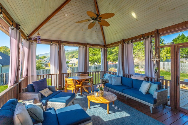 sunroom featuring ceiling fan, wood ceiling, and lofted ceiling