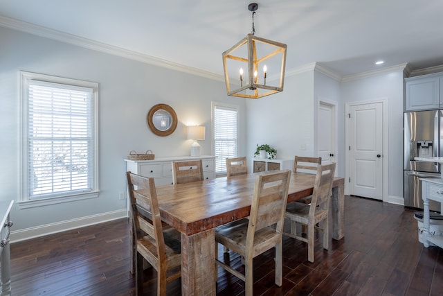 dining room with dark hardwood / wood-style flooring, a notable chandelier, and crown molding