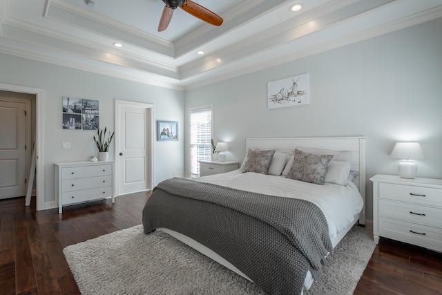 bedroom with ceiling fan, dark hardwood / wood-style floors, and ornamental molding