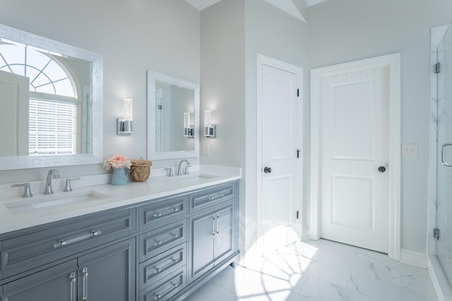 bathroom with walk in shower and vanity