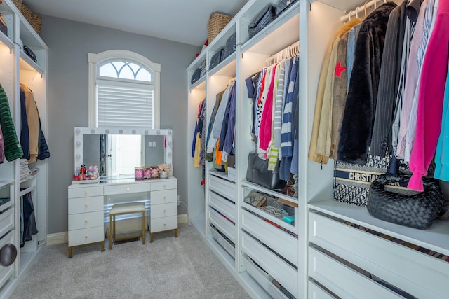 spacious closet with light colored carpet