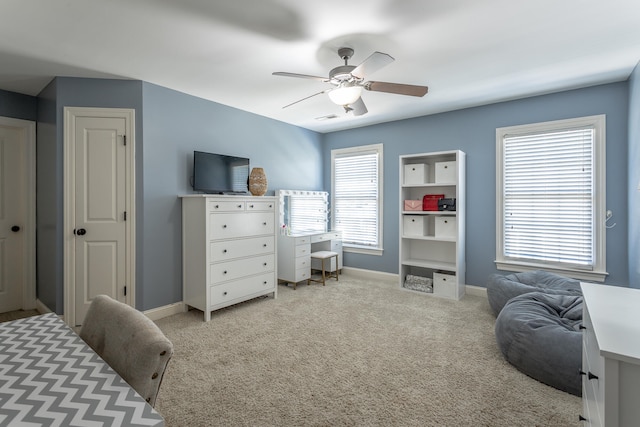 bedroom featuring light carpet and ceiling fan