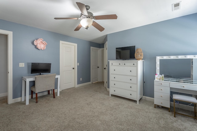 carpeted office with ceiling fan