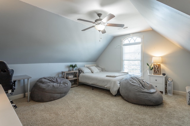 carpeted bedroom featuring vaulted ceiling and ceiling fan