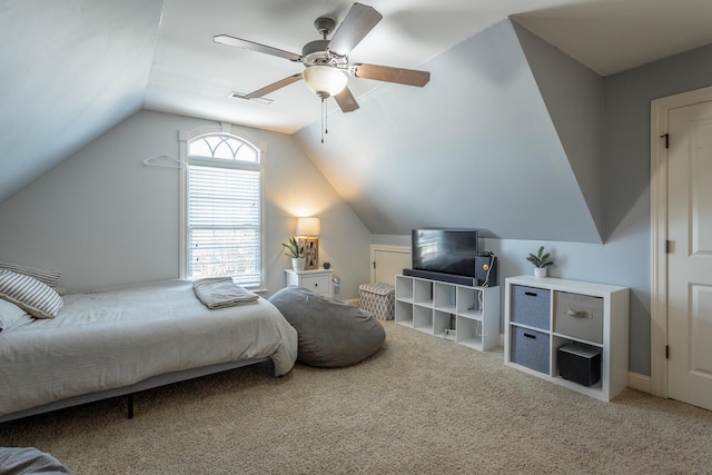 bedroom featuring ceiling fan, carpet flooring, and vaulted ceiling