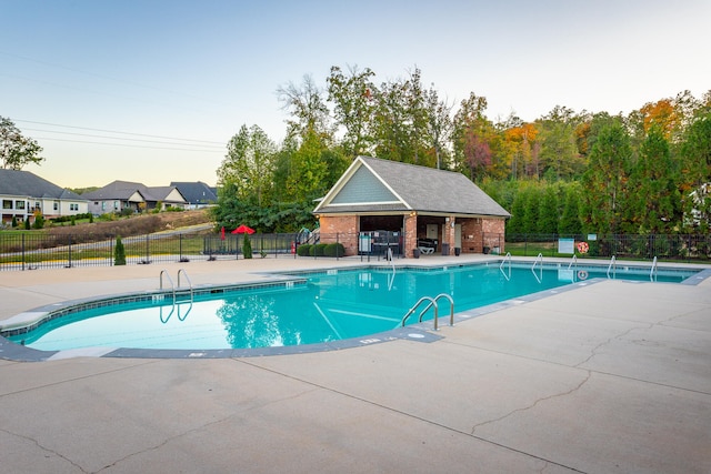 view of swimming pool with a patio area