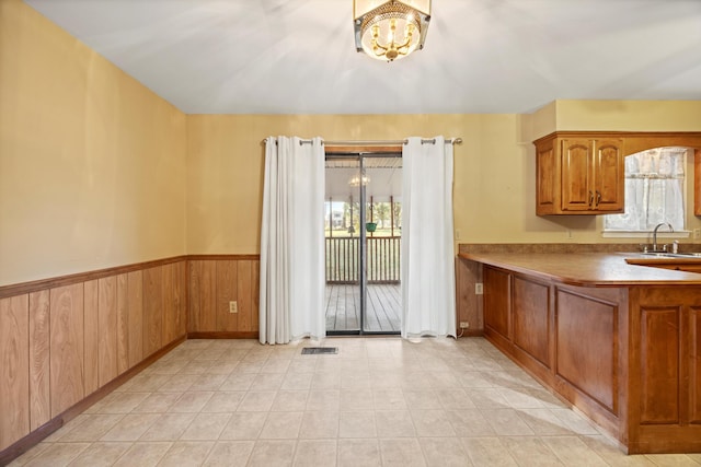 kitchen featuring sink and a notable chandelier