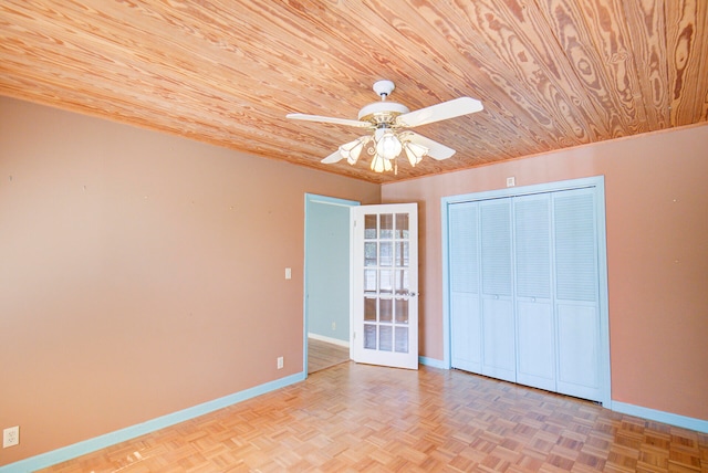 unfurnished bedroom featuring wood ceiling, light parquet floors, and ceiling fan