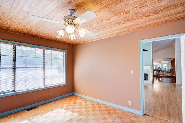 empty room with ceiling fan, wooden ceiling, and lofted ceiling