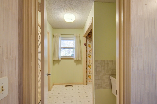 bathroom featuring a textured ceiling