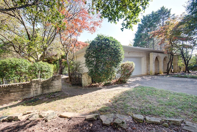 view of property exterior with a garage