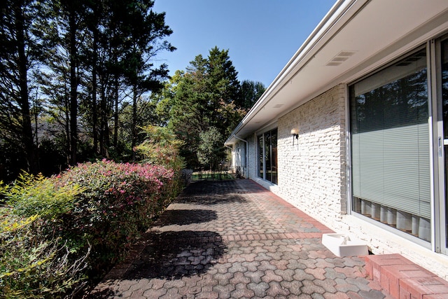 view of property exterior featuring a patio area