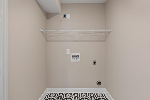 clothes washing area with hookup for a washing machine, tile patterned floors, and electric dryer hookup