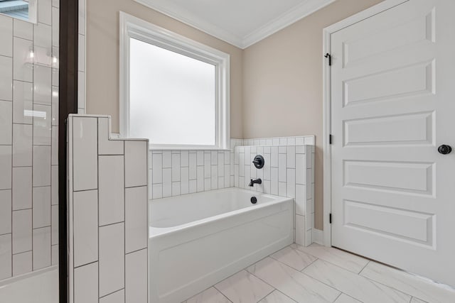 bathroom with a bathing tub and crown molding