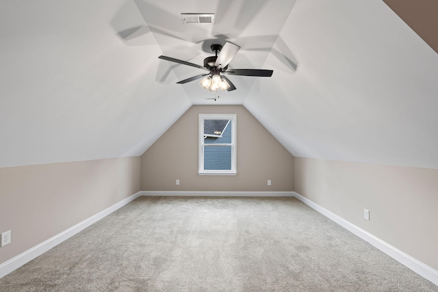 bonus room featuring ceiling fan, light carpet, and vaulted ceiling