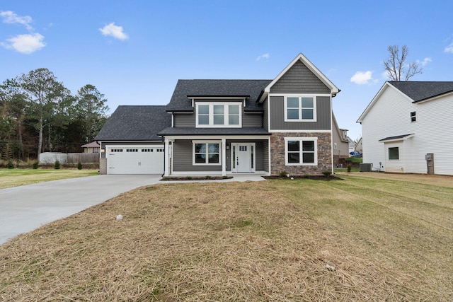 view of front of home featuring a garage and a front lawn