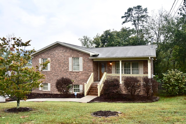 view of front of house featuring a front lawn and covered porch