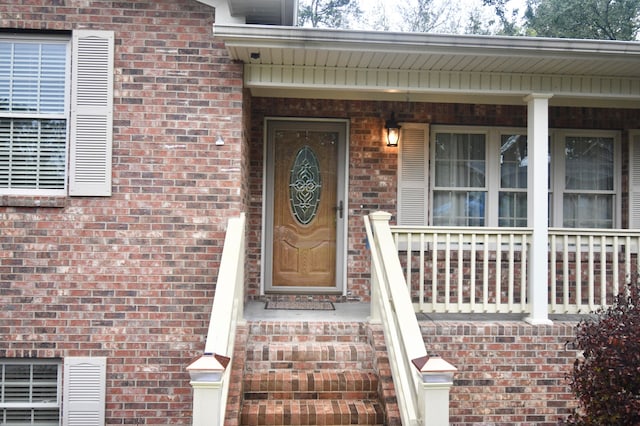 doorway to property featuring a porch