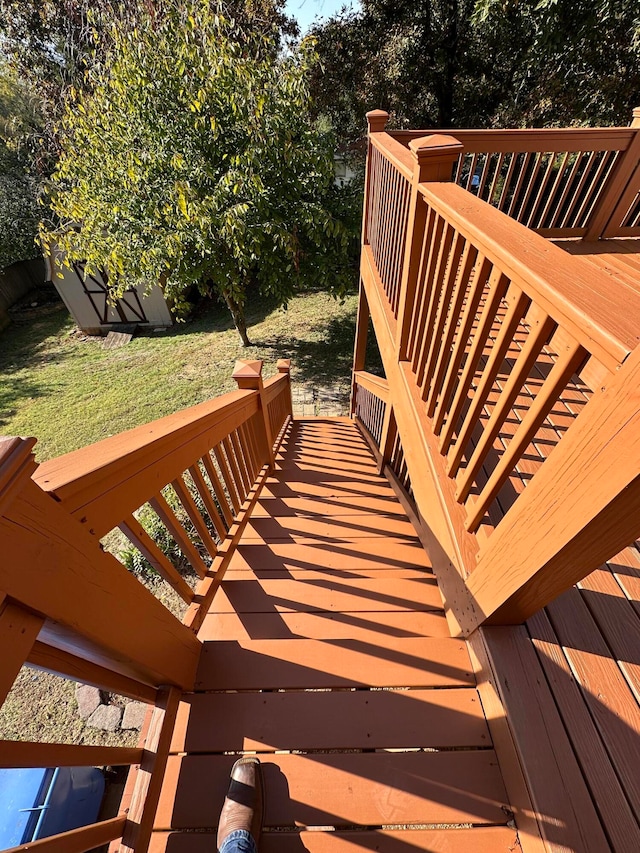 wooden deck with a lawn