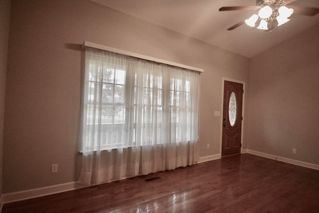 interior space featuring dark wood-type flooring, ceiling fan, and lofted ceiling