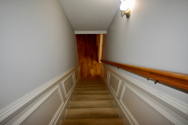 stairs with hardwood / wood-style floors