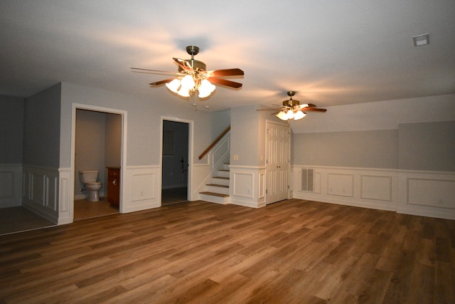 bonus room with hardwood / wood-style floors and ceiling fan