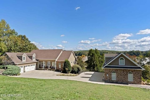 view of front facade with a front yard and a garage