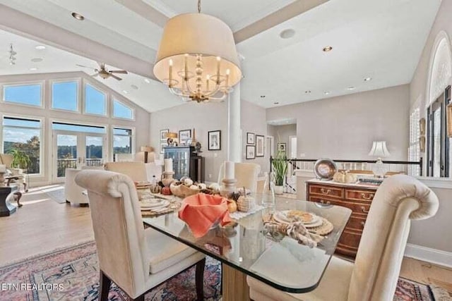 dining room featuring beam ceiling, high vaulted ceiling, ceiling fan with notable chandelier, light hardwood / wood-style floors, and french doors