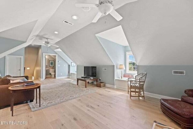 sitting room featuring lofted ceiling, light hardwood / wood-style flooring, and ceiling fan