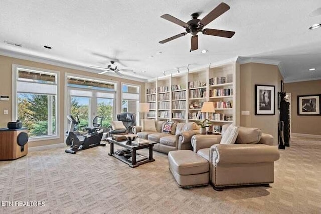 carpeted living room with ornamental molding, a textured ceiling, and ceiling fan