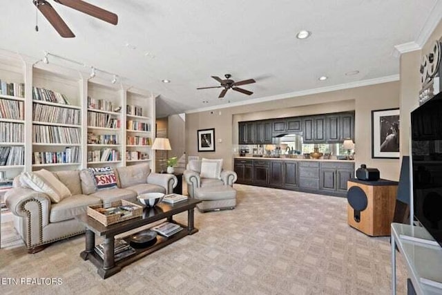 carpeted living room featuring ornamental molding and ceiling fan