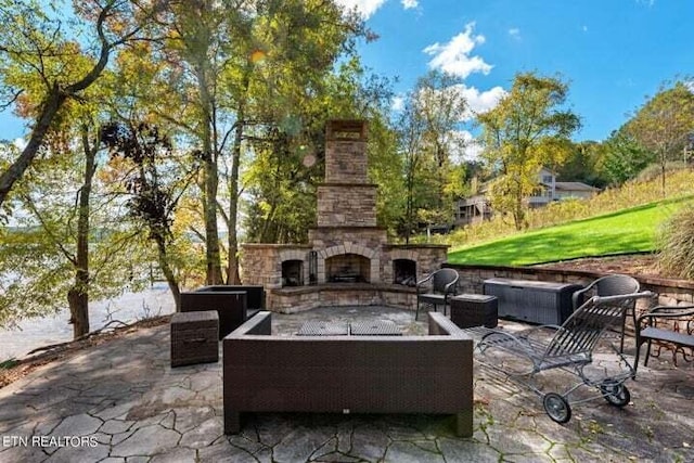 view of patio / terrace featuring an outdoor living space with a fireplace