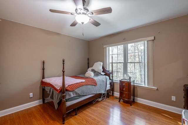 bedroom featuring light hardwood / wood-style flooring and ceiling fan