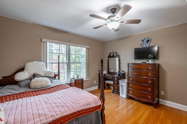 bedroom with light wood-type flooring and ceiling fan