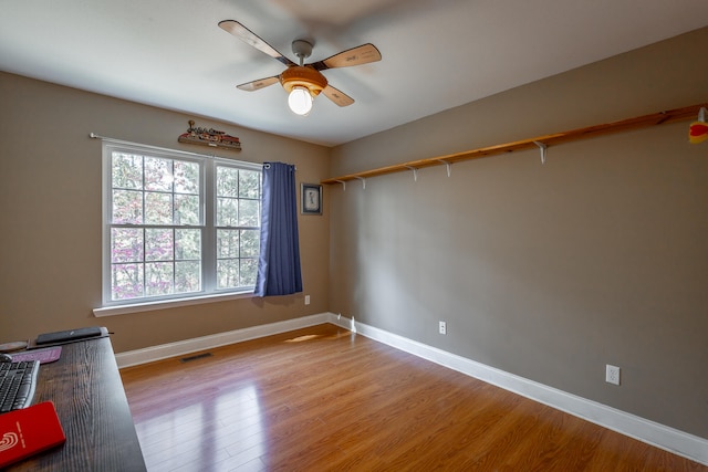 unfurnished room with light hardwood / wood-style floors and ceiling fan