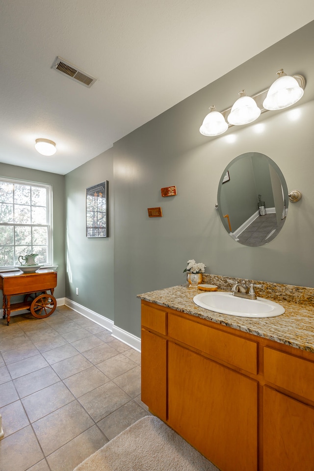 bathroom with vanity and tile patterned floors