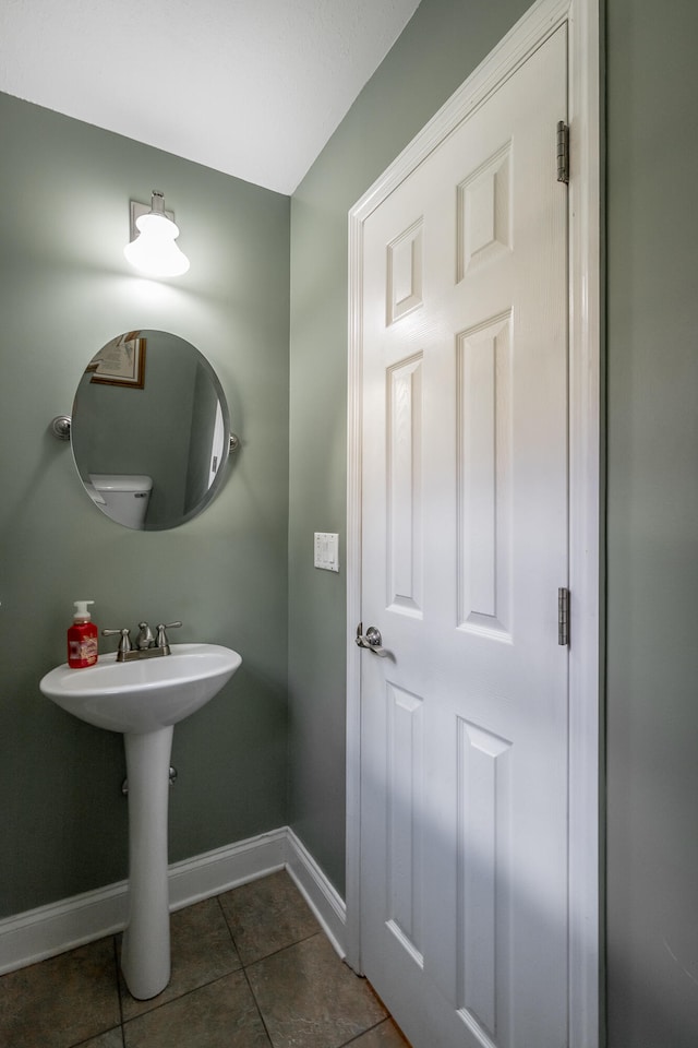 bathroom with sink and tile patterned flooring