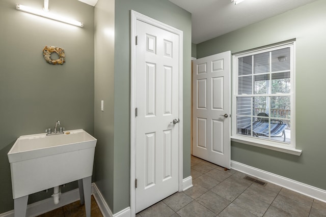 bathroom featuring tile patterned flooring