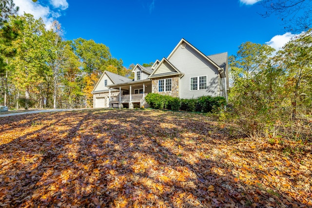 view of front of property with a porch and a garage