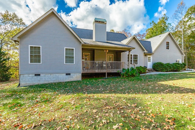 back of house with a yard