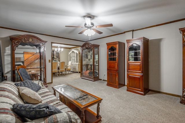 living room featuring light carpet, crown molding, and ceiling fan with notable chandelier