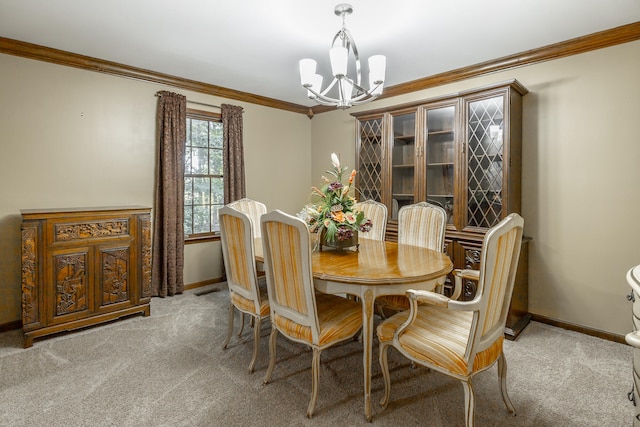 dining room featuring crown molding, carpet floors, and an inviting chandelier