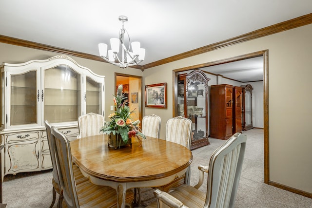 dining area featuring light carpet, crown molding, and a chandelier