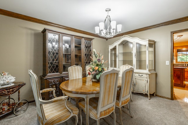 dining area featuring light carpet, crown molding, and an inviting chandelier