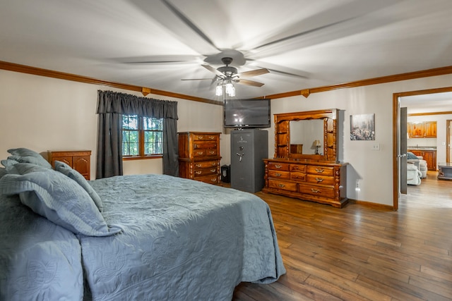 bedroom with ceiling fan, hardwood / wood-style flooring, and crown molding