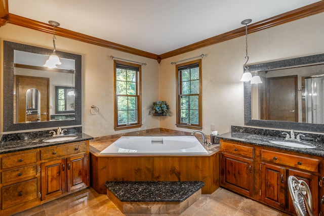 bathroom with vanity, crown molding, a bathtub, and tile patterned flooring