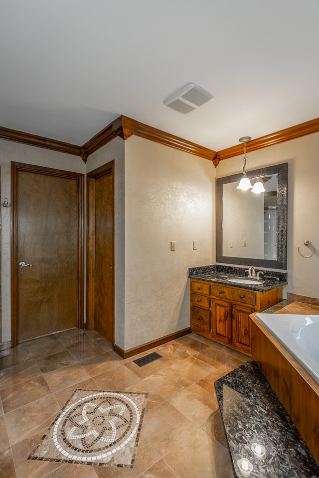 bathroom featuring vanity, ornamental molding, and a tub