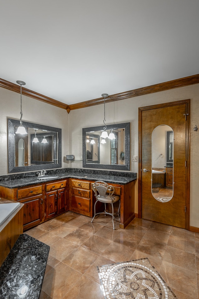 kitchen featuring built in desk, crown molding, and hanging light fixtures