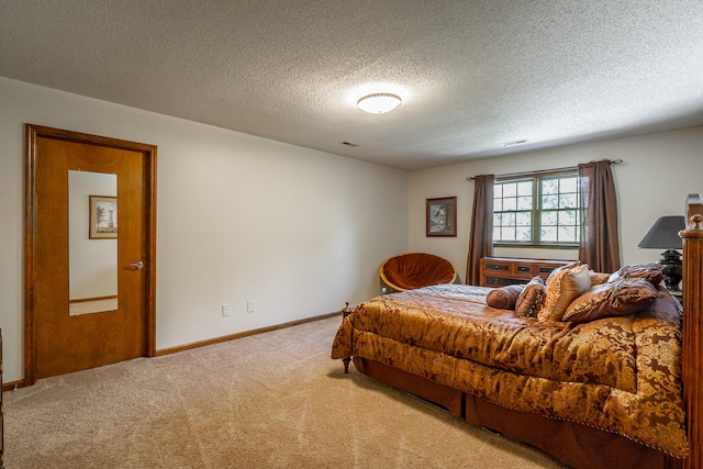 carpeted bedroom with a textured ceiling