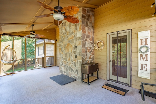 property entrance with a patio area and ceiling fan